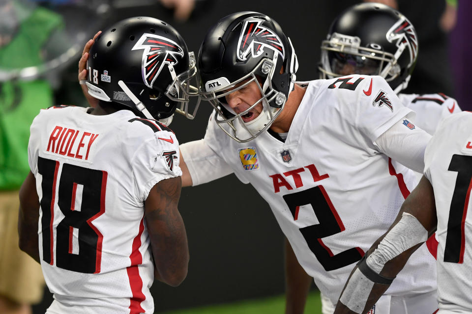 MINNEAPOLIS, MINNESOTA - OCTOBER 18: Calvin Ridley #18 and Matt Ryan #2 of the Atlanta Falcons celebrate after scoring a touchdown in the third quarter against the Minnesota Vikings at U.S. Bank Stadium on October 18, 2020 in Minneapolis, Minnesota. (Photo by Hannah Foslien/Getty Images)