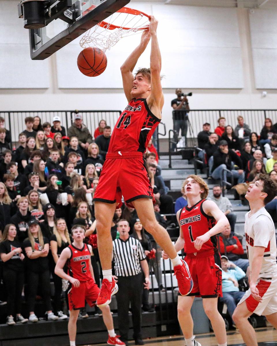 Clinton junior Grant Stockford dunks the ball during Monday&#39s Division 3 regional game against Michigan Center at Dansviille. [Telegram photo by John Discher]