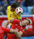 <p>Sweden’s Victor Lindelof, left, heads for the ball with Switzerland’s Granit Xhaka during the round of 16 match between Switzerland and Sweden at the 2018 soccer World Cup in the St. Petersburg Stadium, in St. Petersburg, Russia, Tuesday, July 3, 2018. (AP Photo/Efrem Lukatsky) </p>