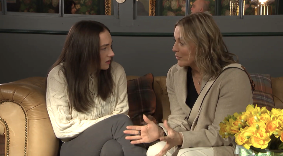 frankie and suzanne in hollyoaks, a young woman and her mom sit on a sofa talking