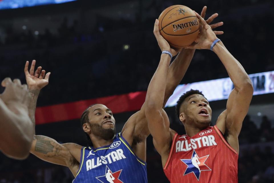 Kawhi Leonard of the Los Angeles Clippers blocks a shot of Giannis Antetokounmpo of the Milwaukee Bucks during the second half of the NBA All-Star basketball game Sunday, Feb. 16, 2020, in Chicago. (AP Photo/Nam Huh)