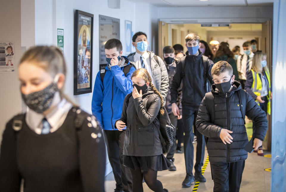 Students at St Columba's High School, Gourock, wear protective face masks as they head to lessons as the requirement for secondary school pupils to wear face coverings when moving around school comes into effect from today across Scotland. (Photo by Jane Barlow/PA Images via Getty Images)