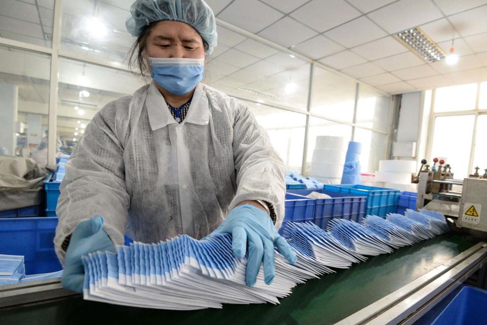 A worker producing face masks at a factory in Handan in China's northern Hebei province (AFP via Getty Images)