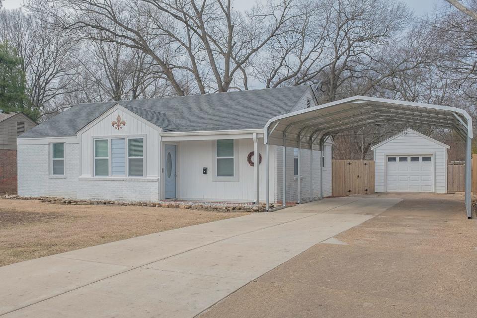 The traditional painted brick home was built in 1951.