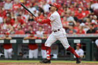 Cincinnati Reds' Joey Votto watches his three-run home run during the third inning of the team's baseball game against the Colorado Rockies in Cincinnati, Friday, June 11, 2021. (AP Photo/Aaron Doster)