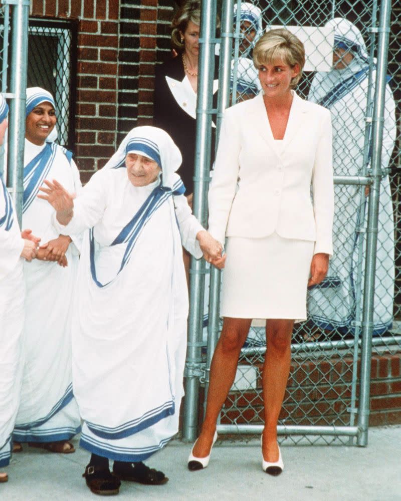 Her clean cut white skirt suit