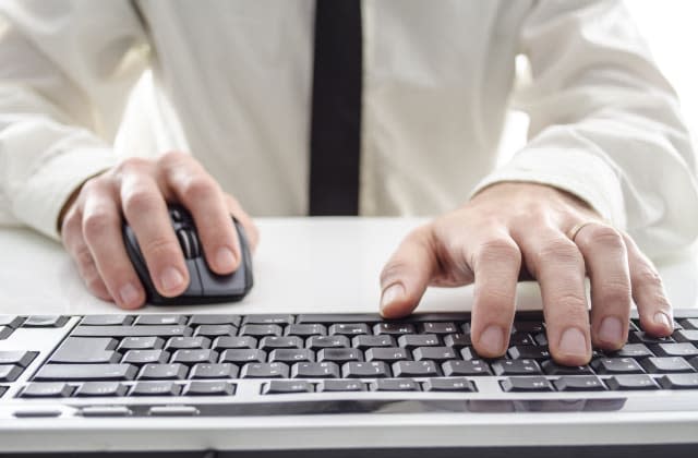 closeup of a man using computer....