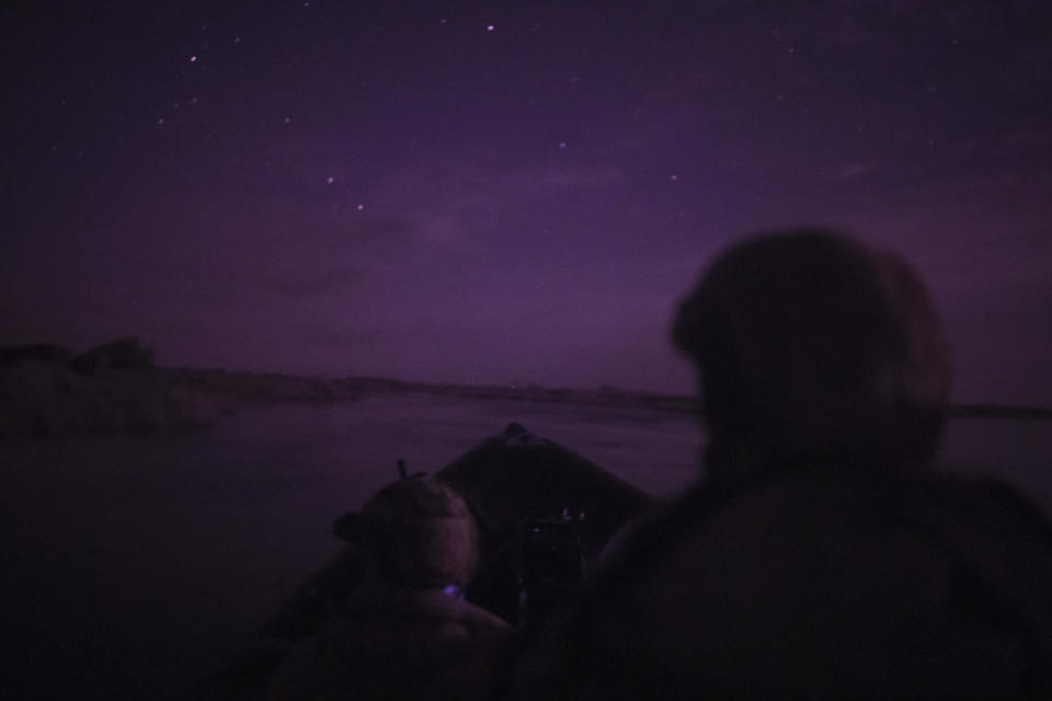 Ukraine Special Operations Forces soldiers navigate the Dnipro River using night vision goggles, or NVG, during a night mission in Kherson region, Ukraine, Saturday, June 10, 2023. (AP Photo/Felipe Dana)