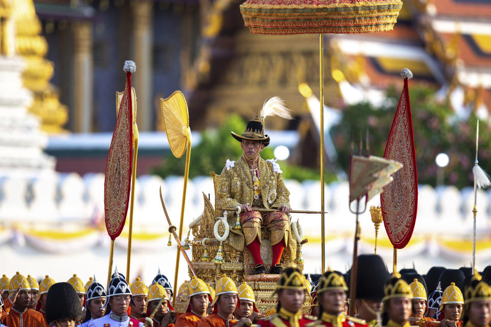 Thailand’s King Maha Vajiralongkorn is carried on a palanquin through the streets outside the Grand Palace for the public to pay homage during the second day of his coronation ceremony in Bangkok, Sunday, May 5, 2019. Vajiralongkorn was officially crowned Saturday amid the splendor of the country's Grand Palace, taking the central role in an elaborate centuries-old royal ceremony that was last held almost seven decades ago. (AP Photo/Wason Wanichorn)