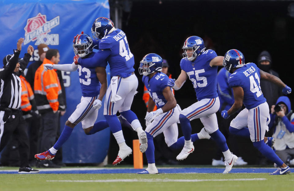 New York Giants defensive back Sam Beal (23) celebrates with teammates after tackling Miami Dolphins running back Patrick Laird (42) in the end zone for a safety during the third quarter of an NFL football game, Sunday, Dec. 15, 2019, in East Rutherford, N.J. (AP Photo/Adam Hunger)