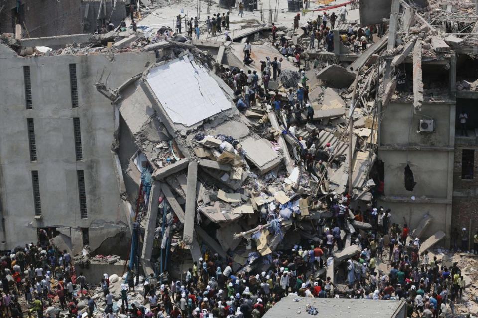 People rescue garment workers trapped under rubble at the Rana Plaza building after it collapsed, in Savar, 19 miles outside Dhaka April 24, 2013. (Andrew Biraj/Reuters)