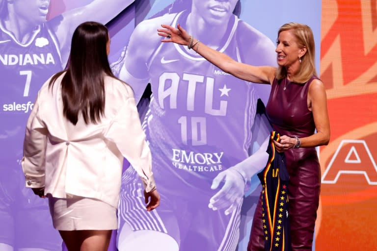 WNBA Commissioner Cathy Engelbert congratulates Caitlin Clark, who was selected first overall by the <a class="link " href="https://sports.yahoo.com/wnba/teams/indiana/" data-i13n="sec:content-canvas;subsec:anchor_text;elm:context_link" data-ylk="slk:Indiana Fever;sec:content-canvas;subsec:anchor_text;elm:context_link;itc:0">Indiana Fever</a> in the 2024 WNBA draft (Sarah Stier)