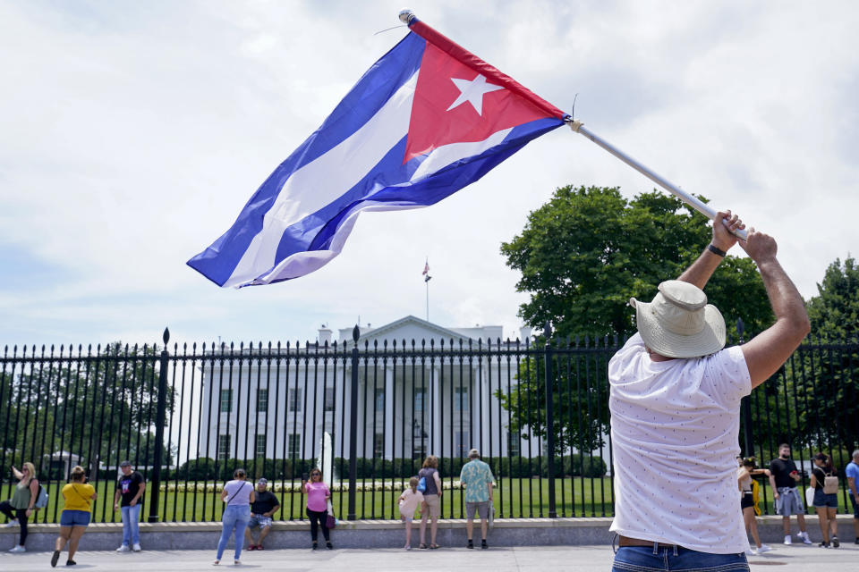 People participate in a rally outside the White House in Washington, Tuesday, July 13, 2021, in support of the protesters in Cuba. The problems of two tiny Caribbean states, Cuba and Haiti, have vexed U.S. presidents for decades. Now, Haiti and Cuba are posing a growing challenge for President Joe Biden that could have political ramifications.(AP Photo/Susan Walsh)