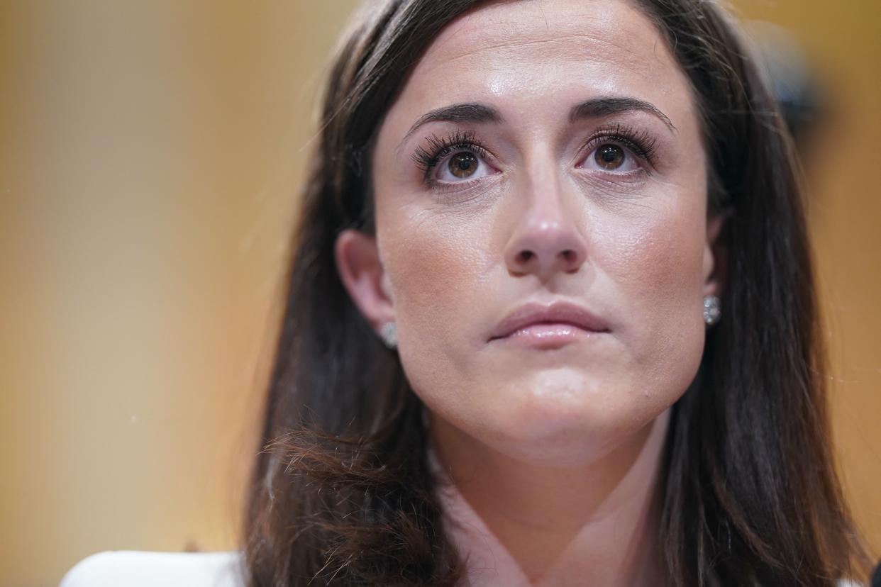 Cassidy Hutchinson takes her seat before testifying at the Tuesday's House select committee hearing. (Photo by Stefani Reynolds/AFP via Getty Images)