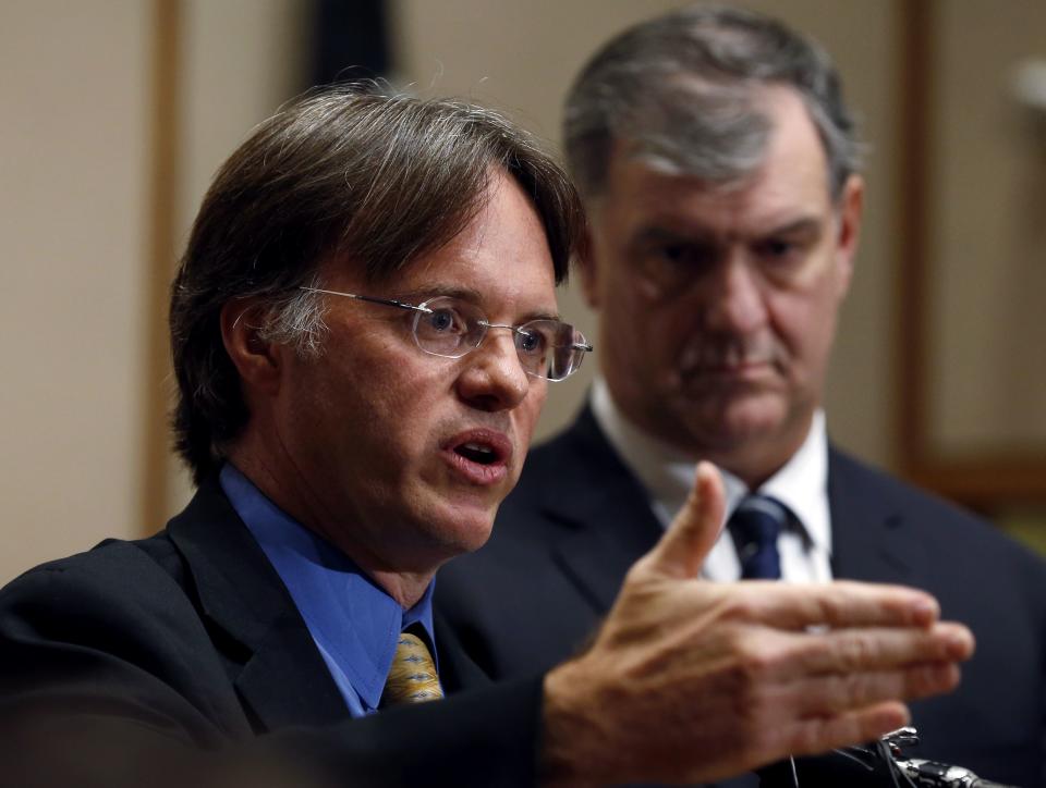 Dr. David Lakey, left, speaks at a news conference with Dallas Mayor Mike Rawlings, on Oct. 6, 2014. (Jim Young/Reuters)