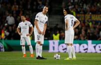 PSG's Zlatan Ibrahimovic, Edinson Cavani and Yohan Cabaye look dejected after Neymar (not pictured) scored the second goal for Barcelona. Reuters / Paul Hanna