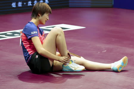 China's Ding Ning falls on the court during her women's singles final table tennis match against her compatriot Liu Shiwen in the World Table Tennis Championships in Suzhou, Jiangsu province May 2, 2015. REUTERS/Aly Song