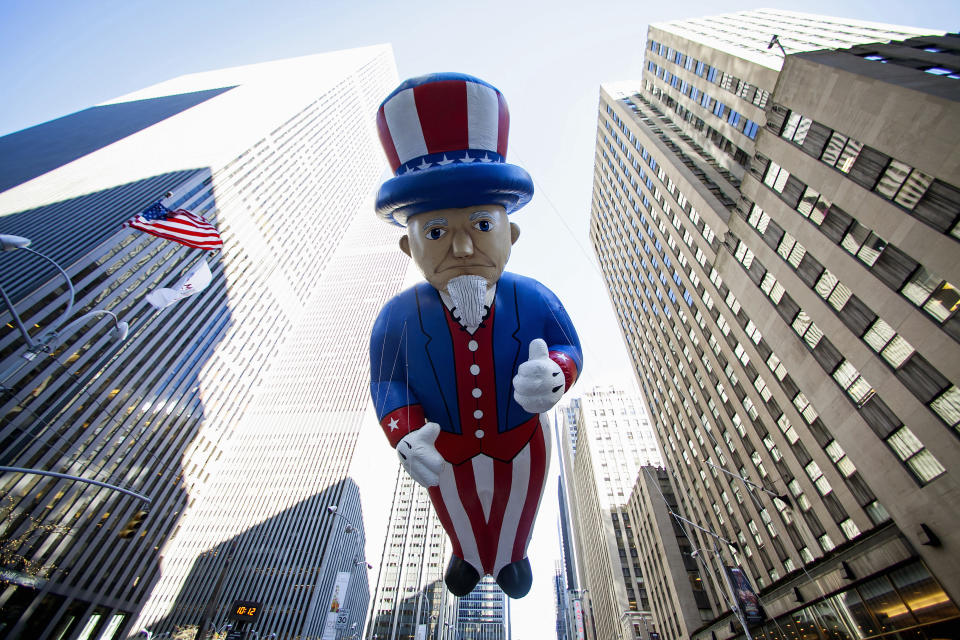 An Uncle Sam balloon floats down Sixth Avenue during the 87th Macy's Thanksgiving Day Parade in New York November 28, 2013. REUTERS/Eric Thayer (UNITED STATES - Tags: SOCIETY ENTERTAINMENT TPX IMAGES OF THE DAY)