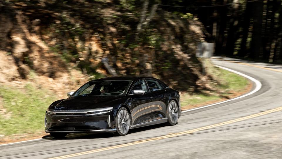 black 2024 lucid air on twisty road