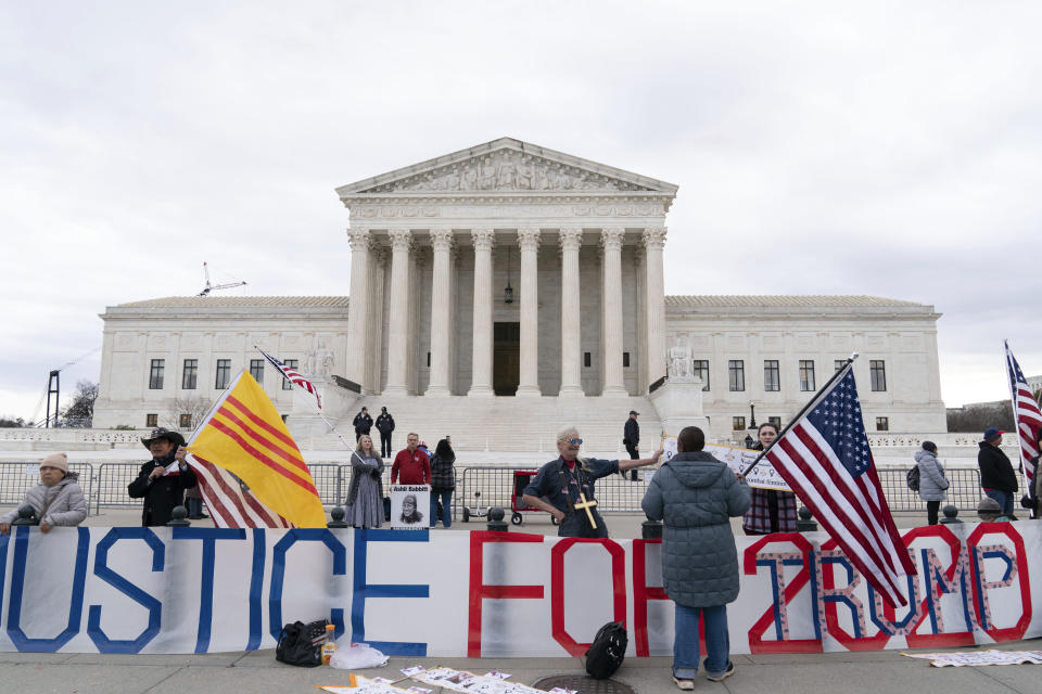 Supporters of former President Donald Trump protest outside of the Supreme Court on the second anniversary of the Jan. 6, assault on the U.S. Capitol, in Washington, Friday, Jan. 6, 2023. (AP Photo/Jose Luis Magana)