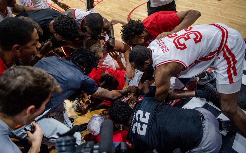 Players and fans mob Marcellus Sommerville of Always A Brave after he sunk the game-winner over Chicago Hoopville Warriors in the 1st round of The Basketball Tournament on Saturday, July 24, 2021 at Carver Arena in Peoria. Always A Brave advanced with a 75-73 victory.