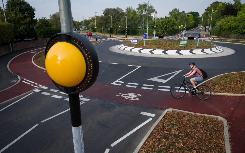 It provides an outer ring for cyclists and zebra crossings for pedestrians, requiring motorists to yield to both before entering - Leon Neal/Getty Images Europe