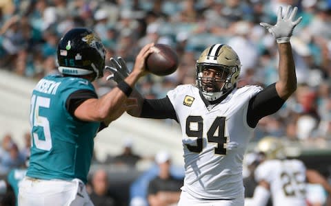 New Orleans Saints defensive end Cameron Jordan (94) tries to block a pass by Jacksonville Jaguars quarterback Gardner Minshew, left, during the second half of an NFL football game, Sunday, Oct. 13, 2019, in Jacksonville - Credit: AP