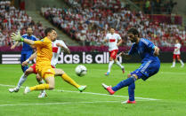 WARSAW, POLAND - JUNE 08: Wojciech Szczesny of Poland blocks the effort from Giorgos Samaras of Greece during the UEFA EURO 2012 group A match between Poland and Greece at The National Stadium on June 8, 2012 in Warsaw, Poland. (Photo by Michael Steele/Getty Images)