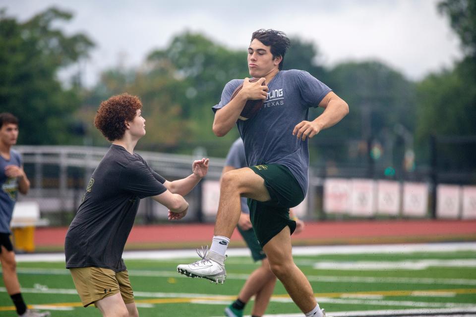 Sabino Portella, RB/DB, runs a play during Red Bank Catholic morning football practice at Count Basie Field in Red Bank, NJ Monday, August 1, 2022.