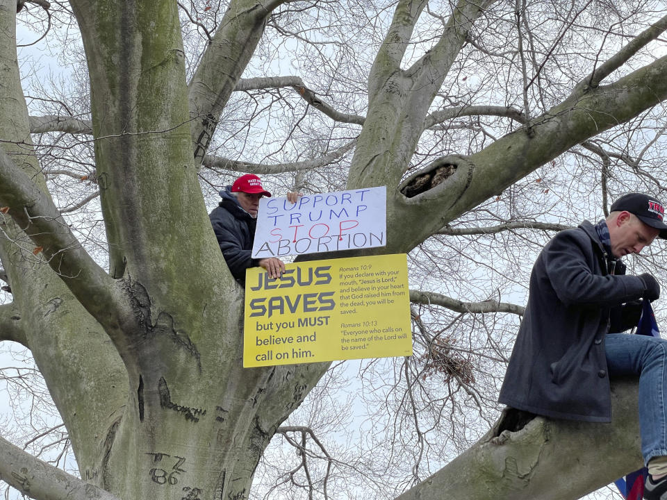 A Trump supporter displays a "Jesus Saves" sign at a rally at the U.S. Capitol on Jan. 6. (Photo: zz/STRF/STAR MAX/IPx)