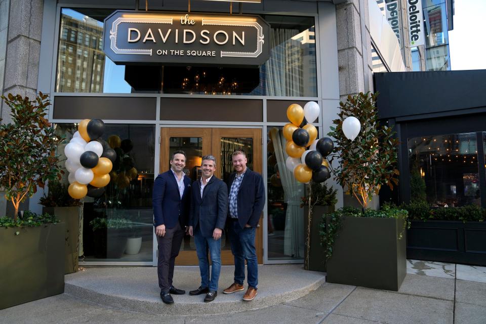 Thunderome Restaurant Group owners John Lanni, left, Joe Lanni and Alex Blust stand in front of their new restaurant, The Davidson, which is located across the street from Fountain Square