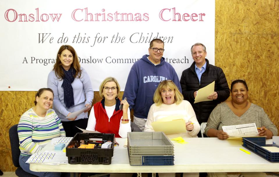 Onslow Community Outreach members smile during Christmas Cheer.