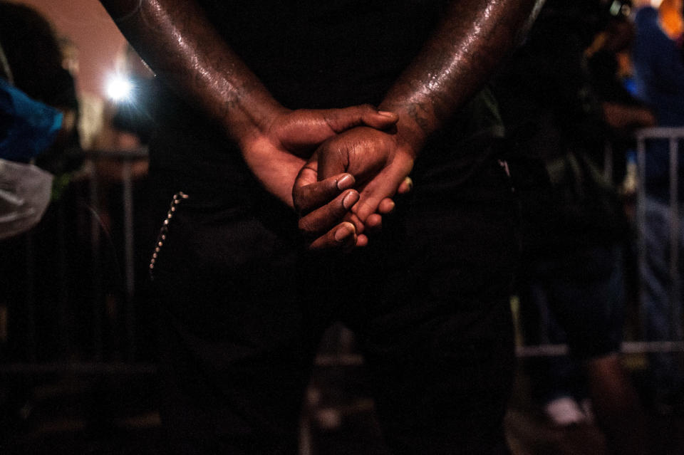 A protester stands outside the Justice Center&nbsp;in St. Louis on Monday evening. (Photo: Joseph Rushmore for HuffPost)