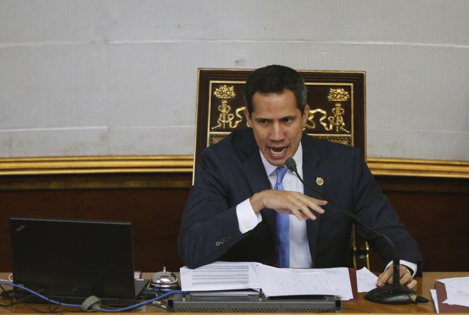 FILE - In this Sept. 17, 2019 file photo, Venezuelan opposition leader and self-proclaimed interim president of Venezuela Juan Guaido speaks during a weekly session at the National Assembly in Caracas, Venezuela. The United States and more than a dozen Latin American countries are meeting Monday, Sept. 23 to consider multilateral sanctions against Venezuela. The foreign ministers are expected to discuss a range of punishments, including loss of diplomatic recognition and an economic boycott. Many of the participating countries recognize Guaidó as Venezuela's legitimate leader after he declared himself interim president in January, citing what was seen as President Nicolás Maduro's fraudulent re-election last year. (AP Photo/Ariana Cubillos, File)