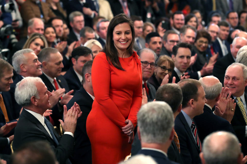 WASHINGTON, DC - FEBRUARY 06: Rep. Elise Stefanik (R-NY) (C) stands as she's acknowledged by U.S. President Donald Trump as he speaks one day after the U.S. Senate acquitted on two articles of impeachment, in the East Room of the White House February 6, 2020 in Washington, DC. After five months of congressional hearings and investigations about President Trump’s dealings with Ukraine, the U.S. Senate formally acquitted the president of charges that he abused his power and obstructed Congress.  (Photo by Mark Wilson/Getty Images)