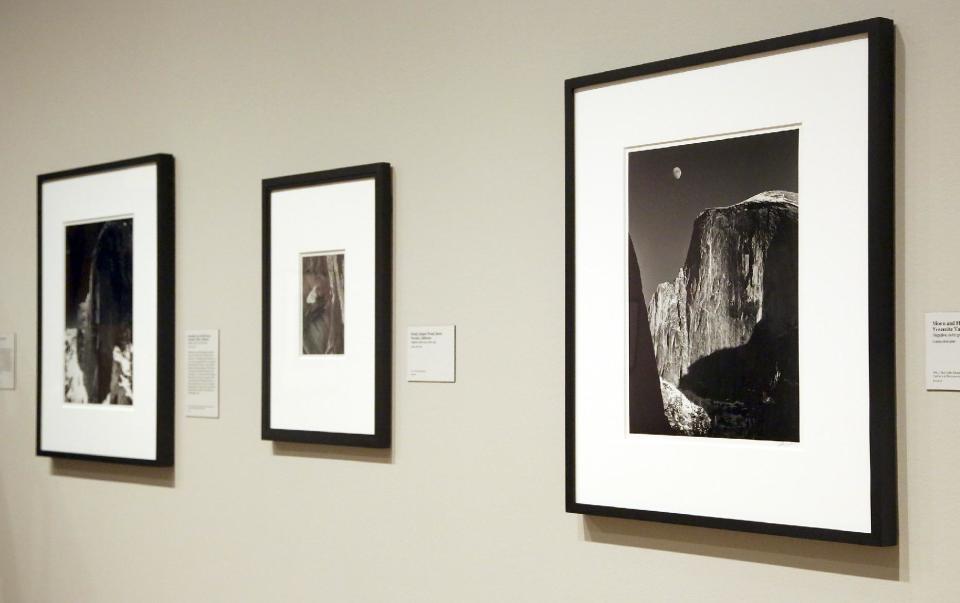 This March 14, 2014 photo shows a photo exhibit entitled, "In Focus: Ansel Adams" at the J. Paul Getty Museum in Los Angeles. Toward the end of his life, photographer Ansel Adams pored over thousands of negatives he'd carefully kept since his teens and set aside 70 that he considered his best works of art. He offered to sell sets of 25, with strings attached: Adams would select 10 and let buyers choose the other 15; the images printed by Adams himself could never be resold, only left to a museum. The few dozen who made the cut included the late Leonard and Marjorie Vernon, whose collection was given to the J. Paul Getty Museum and is the centerpiece of "In Focus: Ansel Adams." (AP Photo/Nick Ut)