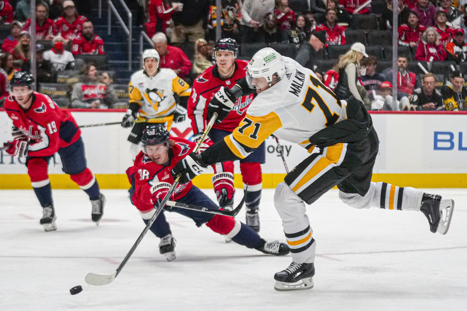 Pittsburgh Penguins center Evgeni Malkin (71) scores in the second period of an opening night NHL hockey game against the Washington Capitals, Friday, Oct. 13, 2023, in Washington. (AP Photo/Andrew Harnik)