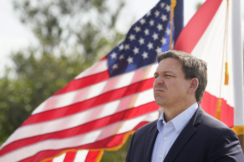 Florida Gov. Ron DeSantis listens during a news conference, Tuesday, Aug. 3, 2021, near the Shark Valley Visitor Center in Miami. DeSantis is doubling down as the state again broke its record for COVID-19 hospitalizations. The Republican governor insisted Tuesday that the spike will be short-lived. (AP Photo/Wilfredo Lee)