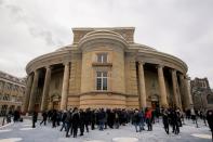 Mourners attend a memorial for the victims of a Ukrainian passenger plane which was shot down in Iran