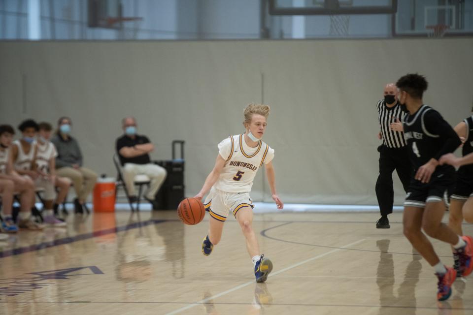 Hononegah's Owen Hart dribbles the ball down the court against Normal West on Saturday, January 15, 2022, at Hononegah High School in Rockton.