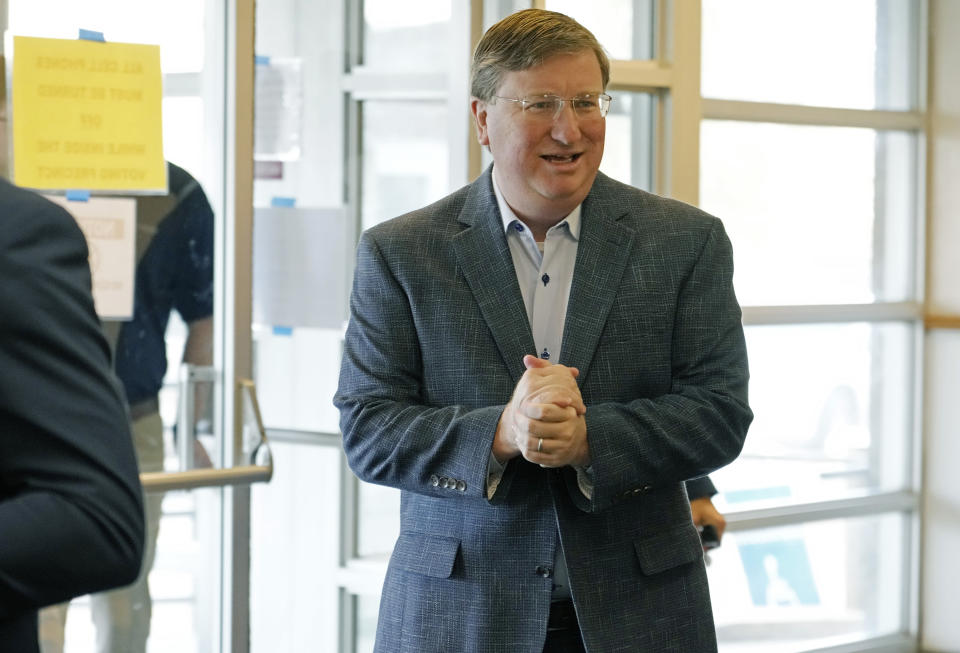 Mississippi Republican Gov. Tate Reeves, enters his Jackson, Miss., precinct to vote, Tuesday, Nov. 7, 2023. Reeves, seeks reelection, and faces Democratic nominee Brandon Presley. (AP Photo/Rogelio V. Solis)