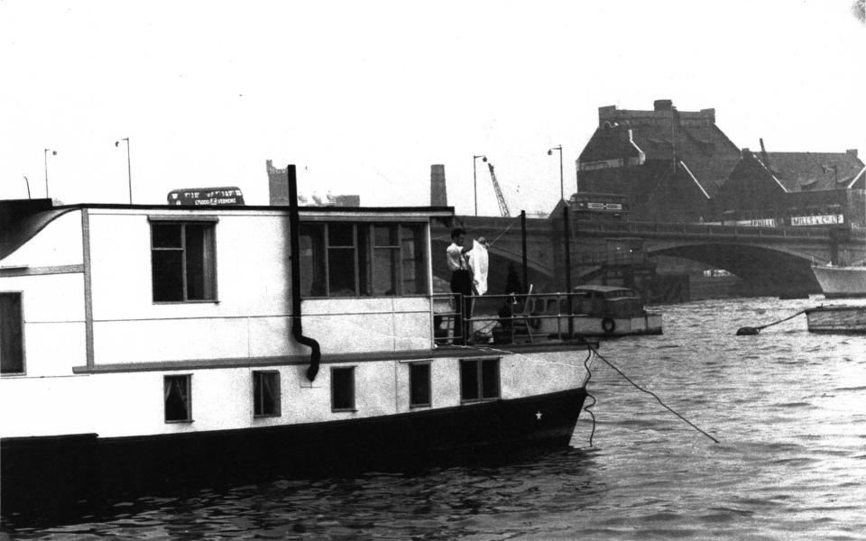 Faulkner aboard a houseboat on the Thames