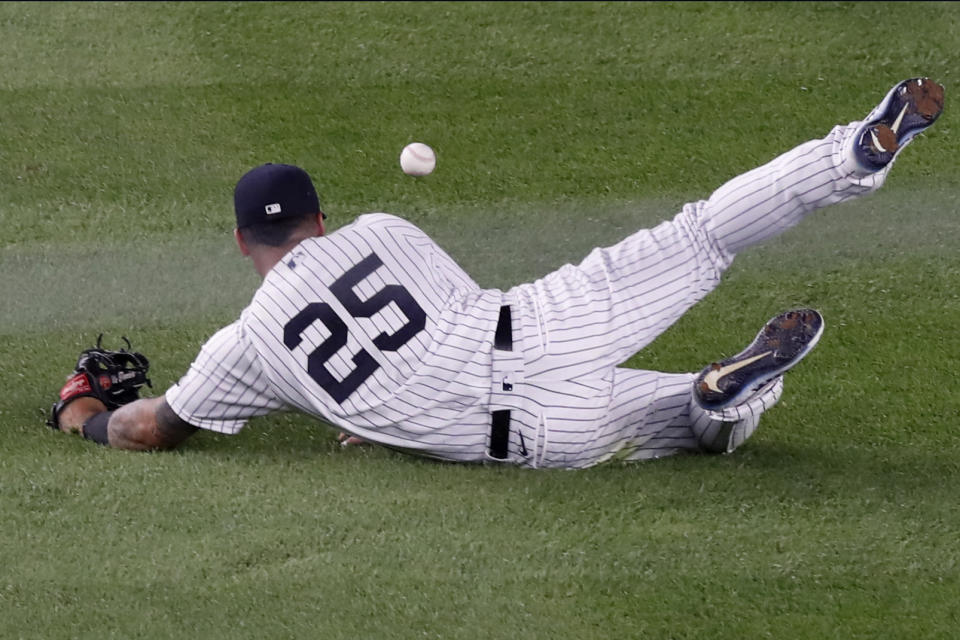 New York Yankees shortstop Gleyber Torres (25) drops Boston Red Sox's Christian Vazquez's fourth-inning single during a baseball game Monday, Aug. 17, 2020, in New York. (AP Photo/Kathy Willens)