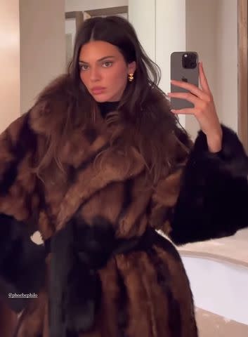 NYFW: Kendall Jenner pairs plaid mini dress and fur coat