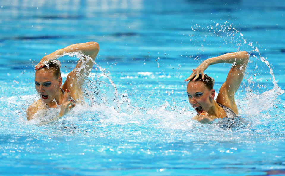 LONDON, ENGLAND - AUGUST 05: Natalia Ishcenko and Svetlana Romashin of Russia compete in the Women's Duets Synchronised Swimming Technical Routine on Day 9 of the London 2012 Olympic Games at the Aquatics Centre on August 5, 2012 in London, England. (Photo by Clive Rose/Getty Images)