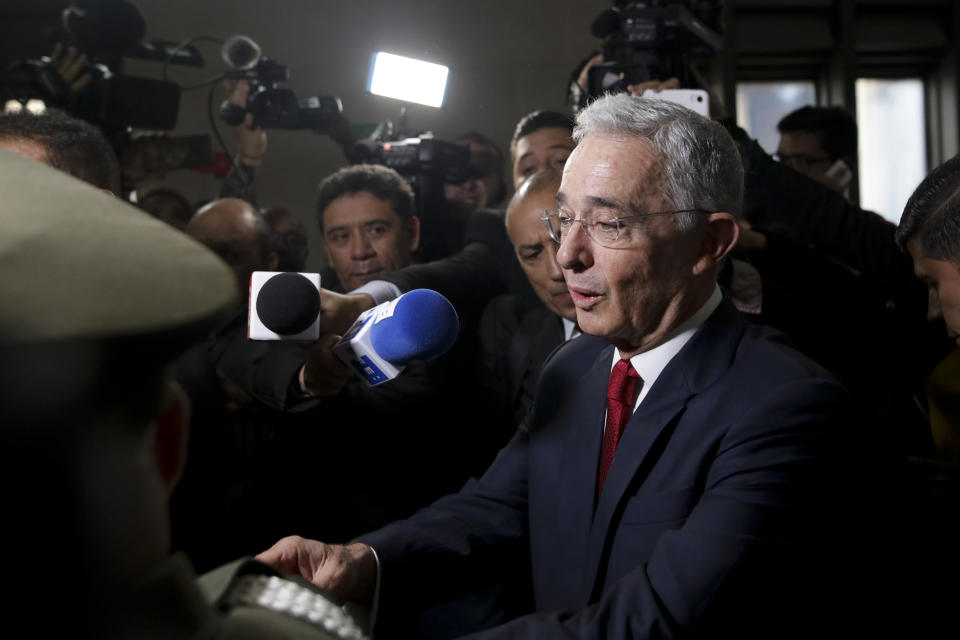 Senator and former president Alvaro Uribe arrives to the Supreme Court to testify in a case involving alleged witness tampering, in Bogota, Colombia, Tuesday, Oct. 8, 2019. Uribe is being investigated for trying to influence and possibly bribe members of a former paramilitary group. The case stems from accusations Senator Ivan Cepeda made several years ago accusing Uribe of being a founder of a paramilitary bloc. (AP Photo/Ivan Valencia)