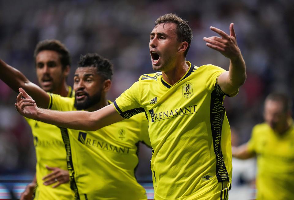 Nashville FC's Jack Maher, front right, celebrates after his goal against the Vancouver Whitecaps during first-half MLS soccer match action in Vancouver, British Columbia, Saturday, Aug. 27, 2022. (Darryl Dyck/The Canadian Press via AP)