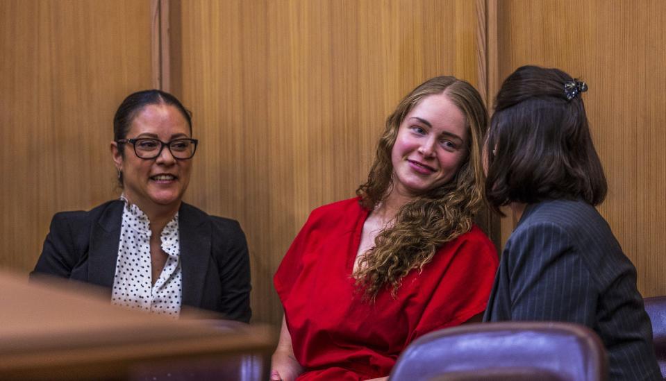 Defense attorneys Tara Kawass, left, and Dianne Caramés share a moment with OnlyFans model Courtney Clenney, center, during a hearing in front of Judge Laura Shearon Cruz, where the computer hacking charges against her and her parents, Deborah and Kim Clenney, were dismissed at the Gerstein Justice Building, Thursday, July 11, 2024, in Miami. Courtney Clenney is accused of stabbing to death her boyfriend in a Miami condo in 2022. The murder charge has not been dropped. (Pedro Portal/Miami Herald via AP)