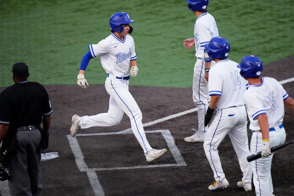 Highlands Callum McAtee crosses the plate after Zach deSylva hits a three-run triple in the fourth inning during the Kentucky Ninth Region championship game, Wednesday, May 24, 2023, at Thomas More Stadium in Florence, Ky. 