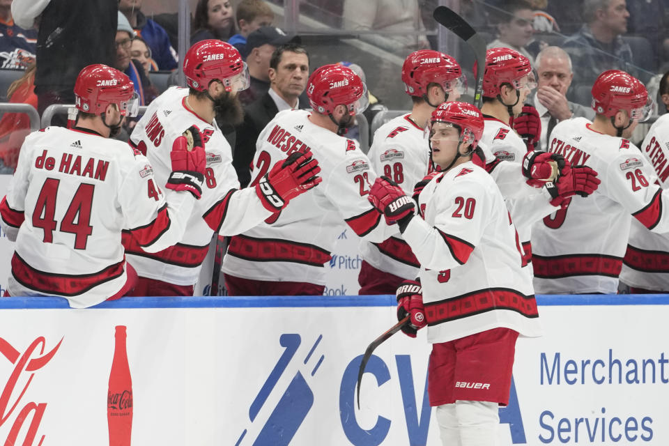 Carolina Hurricanes center Sebastian Aho (20) celebrates after scoring against the New York Islanders during the second period of an NHL hockey game, Saturday, Jan. 21, 2023, in Elmont, N.Y. (AP Photo/Mary Altaffer)